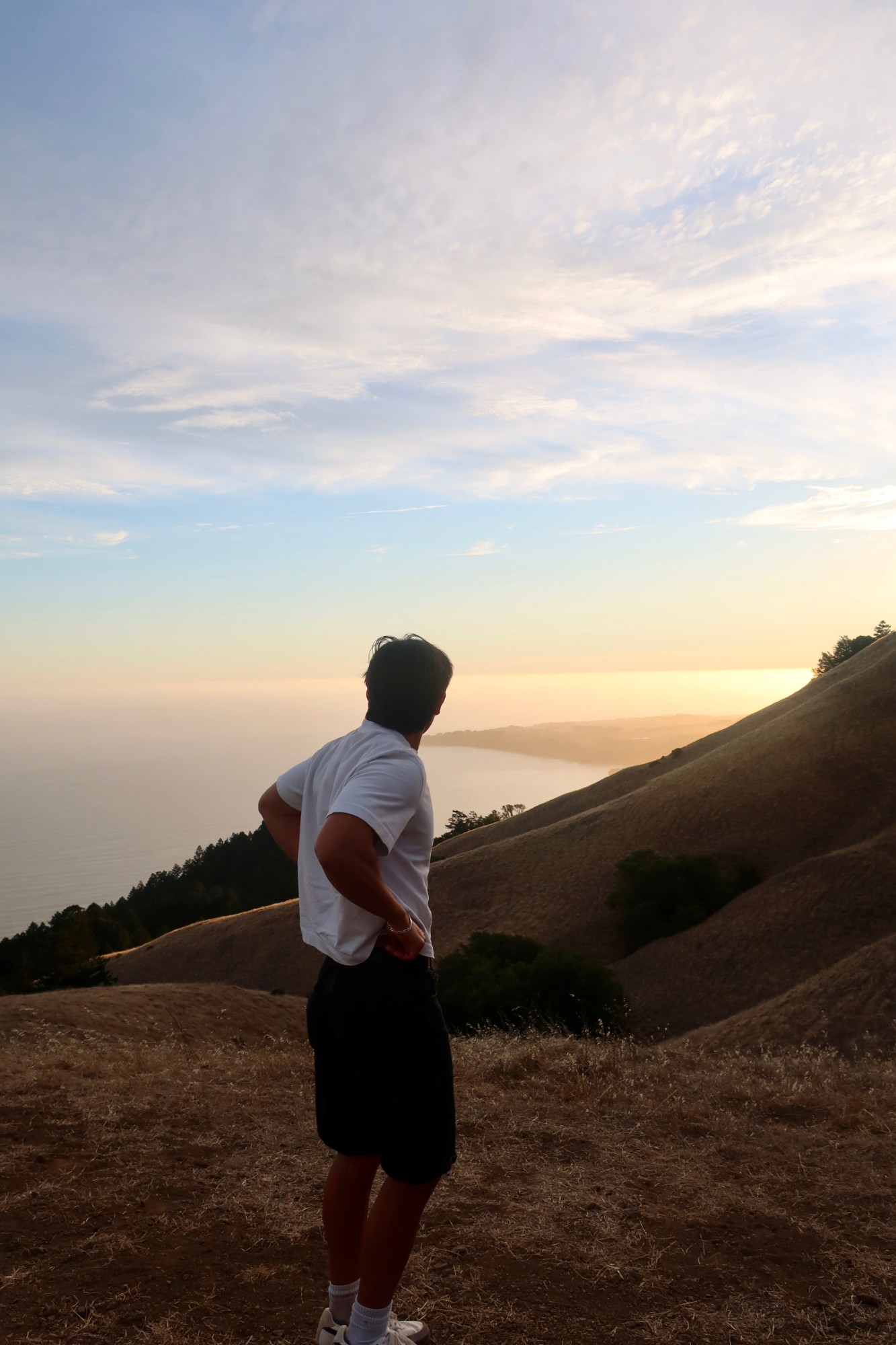 Me looking out over the coast at sunset